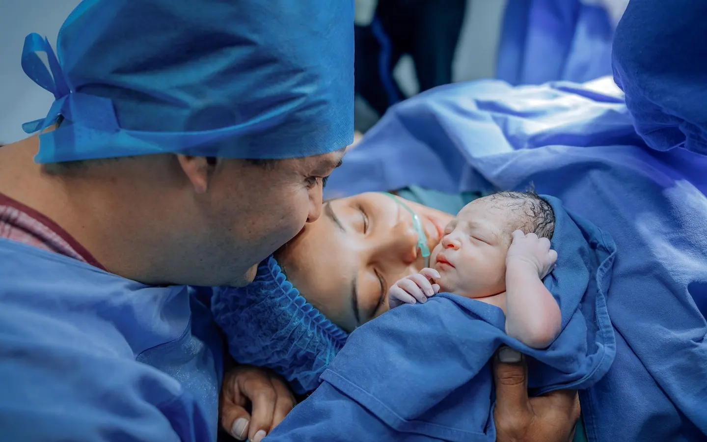 Parents with their newborn child in hospital